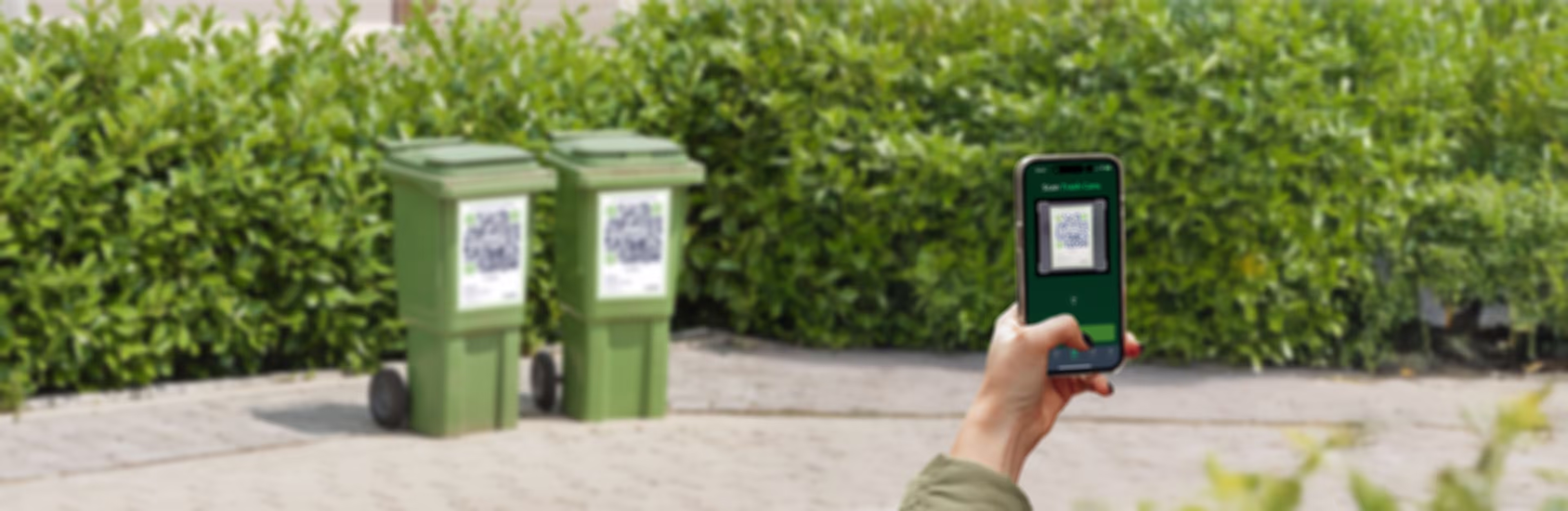 Person fotografiert tonns Mülltonnen